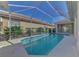 Inviting screened pool with ample deck space at 8508 Gateway Ct, Englewood, FL 34224