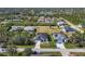 Expansive aerial view showcasing the property's location within a residential community and surrounding landscape at 9157 Genesee St, Port Charlotte, FL 33981