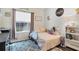 bedroom with a twin bed, plush rug, and decorated walls at 9157 Genesee St, Port Charlotte, FL 33981
