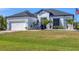 Charming single-Gathering home with well-maintained lawn, garden, and a two car garage at 9157 Genesee St, Port Charlotte, FL 33981