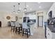 Spacious kitchen with granite countertops, kitchen island with bar stools, and modern appliances at 9157 Genesee St, Port Charlotte, FL 33981