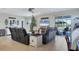 Cozy living room with comfortable seating, a Christmas tree, and a view of the pool at 9157 Genesee St, Port Charlotte, FL 33981