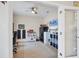 Home office or playroom with a desk, storage units, and a ceiling fan at 9157 Genesee St, Port Charlotte, FL 33981