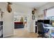Home office with a desk, storage, and a view to the living room at 9157 Genesee St, Port Charlotte, FL 33981