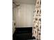 Clean bathroom with shower/tub combo and tropical shower curtain at 97 Mariner Ln, Rotonda West, FL 33947