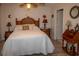 Comfortable bedroom with wicker furniture and ceiling fan at 97 Mariner Ln, Rotonda West, FL 33947