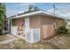 Exterior view of the house with a white fence at 97 Mariner Ln, Rotonda West, FL 33947