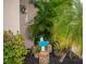 Landscaped front yard with tropical plants and a welcoming sign at 97 Mariner Ln, Rotonda West, FL 33947