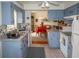Kitchen with light blue cabinets, a double sink, and views to the dining area at 97 Mariner Ln, Rotonda West, FL 33947