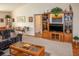 Living room featuring an entertainment center and comfortable seating at 97 Mariner Ln, Rotonda West, FL 33947