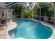 Inviting screened pool area with ample seating at 97 Mariner Ln, Rotonda West, FL 33947