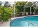 Enjoy this beautiful screened pool and lush landscaping at 97 Mariner Ln, Rotonda West, FL 33947