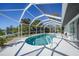 Relaxing screened pool overlooking lush landscaping at 10265 Sunday Dr, Port Charlotte, FL 33981