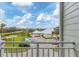 Balcony view of the community clubhouse and manicured lawn at 10390 Longshore Rd # 82, Placida, FL 33946