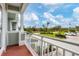 Private balcony overlooking the community's landscaped grounds at 10390 Longshore Rd # 82, Placida, FL 33946