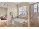 Bathroom with a relaxing garden tub and separate shower at 10390 Longshore Rd # 82, Placida, FL 33946