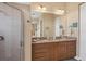 Double vanity bathroom with a large shower and granite countertops at 10390 Longshore Rd # 82, Placida, FL 33946