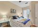 Charming bedroom with a queen-size bed and access to a private balcony at 10390 Longshore Rd # 82, Placida, FL 33946