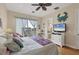 Spacious bedroom with king bed, balcony access, and coastal decor at 10390 Longshore Rd # 82, Placida, FL 33946