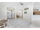 Open living area with tile floors, high ceilings, and a view of the entryway at 108 Broadmoor Ln, Rotonda West, FL 33947