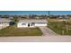 Single-story house with a two-car garage at 11 Oakland Hills Rd, Rotonda West, FL 33947