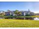 Community canal view, lush lawn, and building exterior at 11 Quails Run Blvd # 11, Englewood, FL 34223