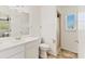 Clean bathroom with single vanity, toilet and shower stall at 11069 Vanessa Ave, Englewood, FL 34224