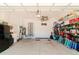 Spacious garage with ample storage shelving and a large door at 122 Glades Dr, Rotonda West, FL 33947