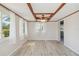 Bright dining room with a ceiling fan, light vinyl floors, and lots of natural light at 1305 Rocky Creek Ln, Englewood, FL 34224