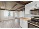 Updated kitchen with butcher block countertop and modern appliances open to living area at 1305 Rocky Creek Ln, Englewood, FL 34224