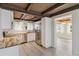 Bright kitchen featuring white cabinets, stainless steel appliances, and butcher block countertops at 1305 Rocky Creek Ln, Englewood, FL 34224