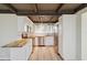 Bright kitchen with stainless steel appliances, butcher block countertops, and wood beam ceiling at 1305 Rocky Creek Ln, Englewood, FL 34224