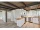 Well-lit kitchen featuring wood countertops, stainless steel appliances, and vinyl flooring at 1305 Rocky Creek Ln, Englewood, FL 34224