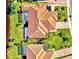 Bird's eye view of home with tile roof and pool at 13091 Creekside Ln, Port Charlotte, FL 33953