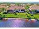 Luxury home with lake access and tropical landscaping at 13091 Creekside Ln, Port Charlotte, FL 33953