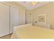 Bright bedroom with a queen bed, built-in closets, and neutral decor at 13091 Creekside Ln, Port Charlotte, FL 33953