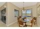 Kitchen dining area with a glass-top table and four chairs at 13091 Creekside Ln, Port Charlotte, FL 33953