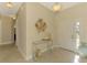 Bright and airy entryway with tile flooring, console table, and view of additional rooms at 13091 Creekside Ln, Port Charlotte, FL 33953