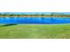 Scenic lakefront property with expansive grassy area at 13091 Creekside Ln, Port Charlotte, FL 33953