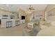 Bright living room features a comfortable seating area and a large TV at 13091 Creekside Ln, Port Charlotte, FL 33953