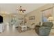 Living room with off-white sofas, coffee table, and a view of the backyard and water feature at 13091 Creekside Ln, Port Charlotte, FL 33953