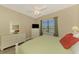 Main bedroom with a king-size bed and large window overlooking the water at 13091 Creekside Ln, Port Charlotte, FL 33953