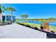 Spacious patio overlooking a serene lake, great for entertaining at 13091 Creekside Ln, Port Charlotte, FL 33953