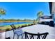 Large patio with lake view, perfect for outdoor relaxation at 13091 Creekside Ln, Port Charlotte, FL 33953