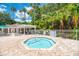 Octagonal hot tub with surrounding brick patio at 13091 Creekside Ln, Port Charlotte, FL 33953