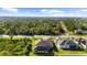 Aerial view of a house with a pool and a surrounding neighborhood at 14010 San Domingo Blvd, Port Charlotte, FL 33981