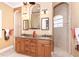 Elegant bathroom with double sinks, granite countertops, and a tiled walk-in shower at 14010 San Domingo Blvd, Port Charlotte, FL 33981