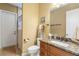 Bathroom with a granite countertop vanity, shower, and decorative accents at 14010 San Domingo Blvd, Port Charlotte, FL 33981