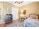 Cozy bedroom with ceiling fan, desk, and vehicle themed decor at 14010 San Domingo Blvd, Port Charlotte, FL 33981