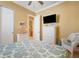 Bedroom with a queen bed, dresser, and access to a bathroom at 14010 San Domingo Blvd, Port Charlotte, FL 33981